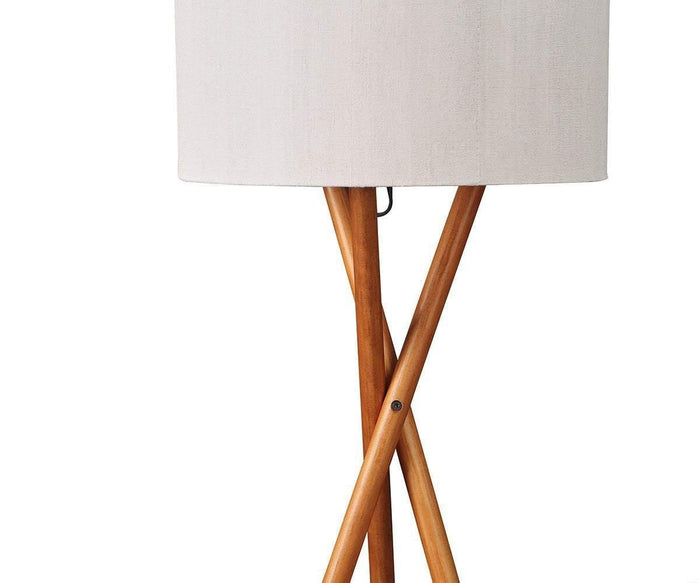 The Gaffel Floor Lamp features a sleek white cylindrical shade and a sturdy tripod base crafted from wooden legs, shown against a white background—a perfect addition to elevate your home decor.