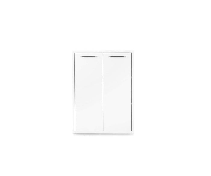 The Gammel Low Bookcase with Doors in WHITE is a wall-mounted cabinet featuring two doors and sleek silver handles. Set against a plain white background, this piece introduces the clean lines of modern design to your space.