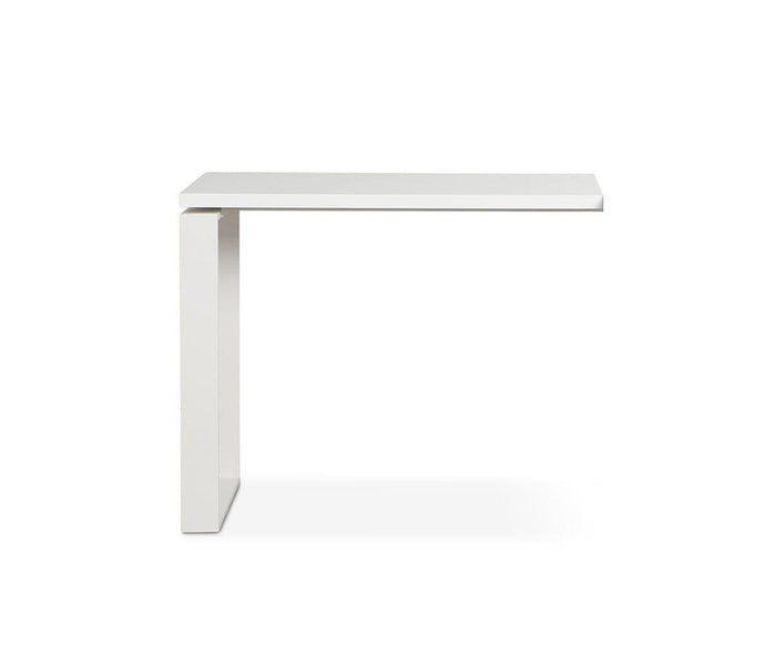 A minimalist, modern white Gammel Return Desk with an L-shaped design is photographed against a plain white background. This eco-friendly desk extension combines sleek style with sustainable craftsmanship.