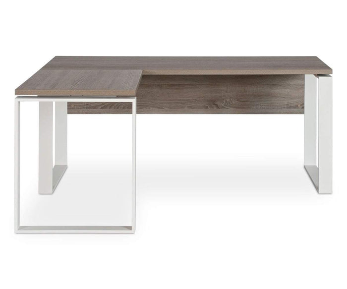 The Gammel Return Desk features a modern L-shaped design with a wooden tabletop and white metal legs, combining minimalist style with eco-friendly materials. Its main rectangular surface and side extension provide ample workspace, making it ideal for both office and home environments. Expertly crafted in Italy, the Gammel Return Desk delivers exceptional quality and contemporary style.