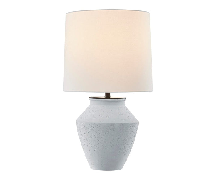 The Glenn Table Lamp features a grey ceramic base designed to mimic weather-resistant cement, paired with a simple cylindrical off-white shade. Softly illuminating any space, it’s perfect as an indoor-outdoor lamp for versatile settings.