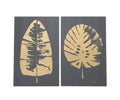 Two panels in Gold/Multi showcase abstract gold leaf prints: the left features a long, narrow leaf, while the right displays a round, wide leaf—each with distinct vein details. The Gold Foliage Graphic Wall Art combines graphic artistry with refined acrylic painting for a sophisticated modern accent.
