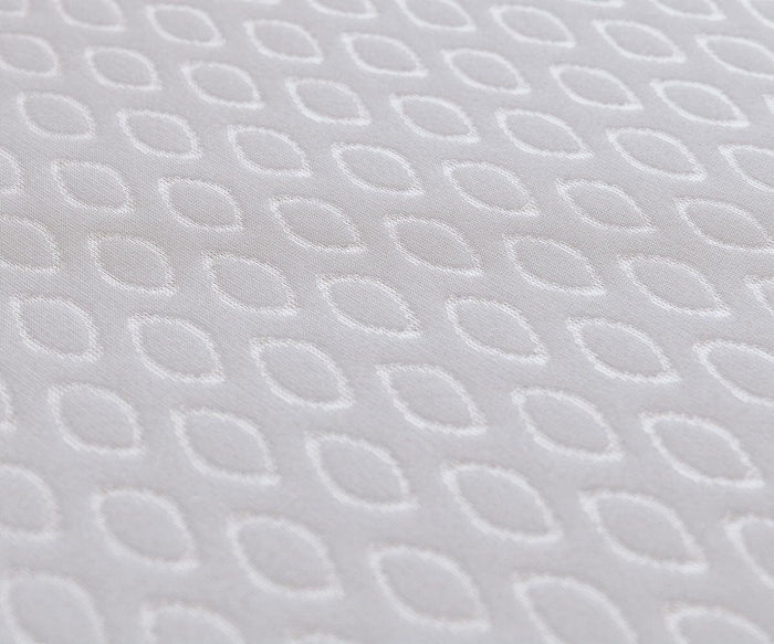 Close-up of a light gray fabric featuring a subtle, textured design created by a repeating pattern of small, oval-shaped, interconnected white outlines—perfectly complementing the Hälsa Sleep™ Ultra Mattress Protector, which combines style and comfort.