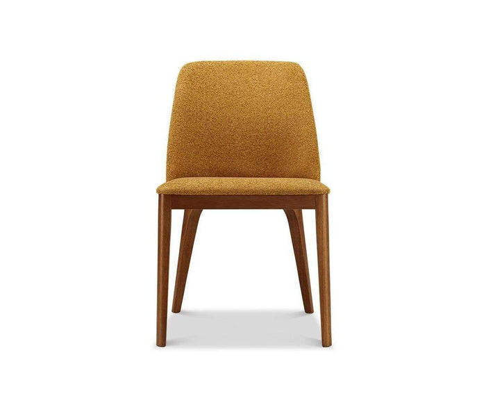 Front view of the Hendrick Dining Chair with a cushioned seat and Scotch upholstered backrest, featuring timber brown wooden legs and a durable frame, set against a white background.