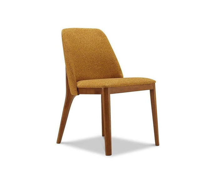 The Hendrick Dining Chair features a sleek, minimalist design with a mustard yellow cushioned seat and backrest, supported by four angled wooden legs. Its slightly reclined back and durable frame provide lasting comfort and contemporary style.