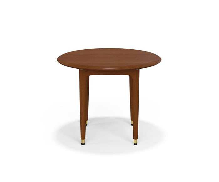 The Hendrick Round End Table, finished in Timber Brown and crafted from American poplar wood, features three tapered legs each accented with a small brass cap at the bottom. The table is showcased against a plain white background.
