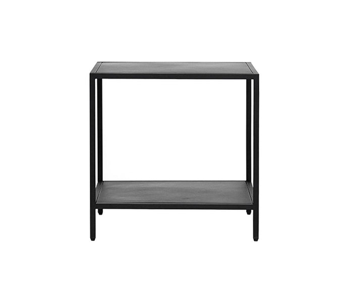 The Heroy End Table features a minimalist black metal design with a rectangular top and an open lower shelf. Its clean lines and matte black finish make it the ideal accent piece for industrial-inspired spaces, especially when paired with white backgrounds.