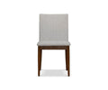 The Holfred Dining Chair, shown from the front against a white background, is a Scandi-inspired wooden chair in Timber Brown with a light gray upholstered seat and backrest.