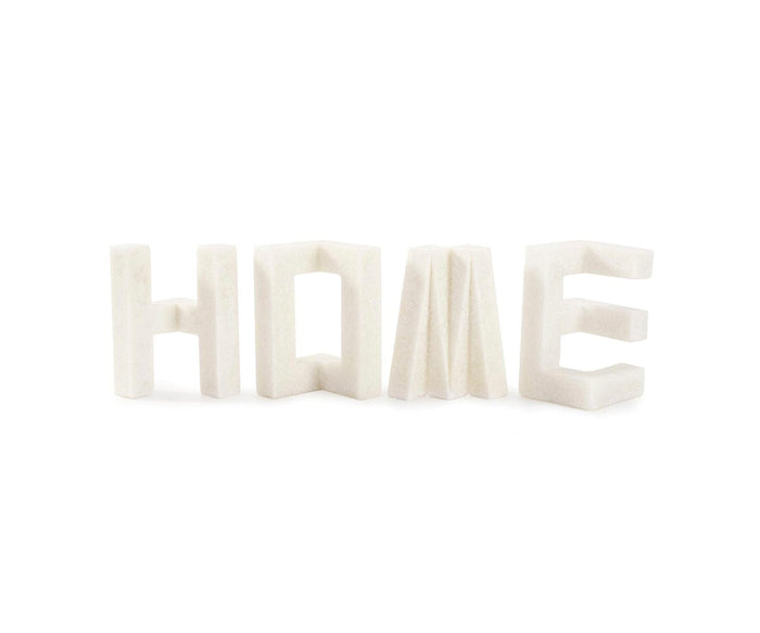 The Home Sculpture displays the word HOME in large, blocky white letters, each standing upright against a plain white background. With its contemporary shape and bright white color, this Home Sculpture is the perfect accent for modern decor.