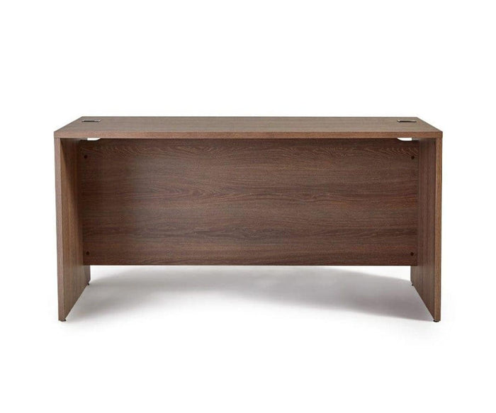 The Inari 63″ Desk in Cool Brown features a rectangular wooden design with a solid back panel, two cable management holes on the desktop, and a dark wood grain finish, blending modern desk functionality with timeless style.