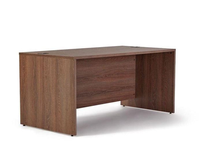 The Inari 63″ Desk is a rectangular wooden office desk with a simple, contemporary design and a dark brown finish. It features solid panel sides and back, without any visible drawers or shelves, making it an excellent option for those seeking a sleek and modern workspace solution.