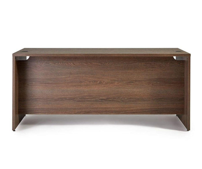 A modern rectangular wooden office desk with a smooth, dark wood finish, viewed from the back. The Inari 71″ Desk features clean lines and no visible drawers or shelves, making it an ideal choice for contemporary workspaces.