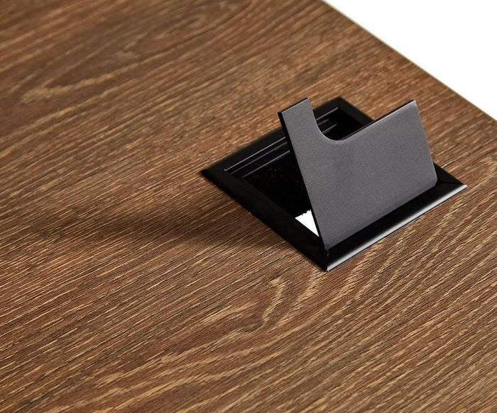 A brown wood-grain Inari 71″ Desk featuring a partially open black rectangular cable management grommet box for organizing wires—an ideal modern desk solution for any office space.