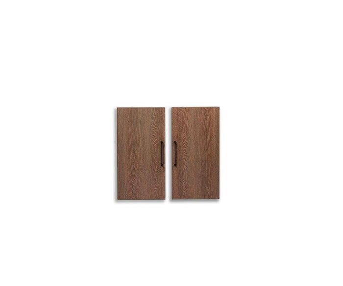 Two cool brown wooden cabinet doors with vertical wood grain, each finished with a sleek black handle on the outer edge, displayed against a plain white background—an ideal Inari Bookcase Door Set to enhance contemporary interiors.
