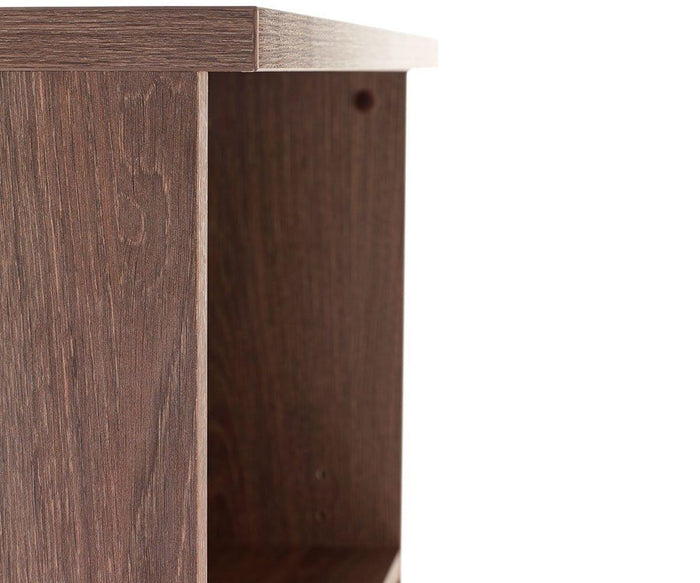 Close-up of the corner of a wooden desk or table, showing the edge detail and wood grain against a plain white background—perfectly complementing the Inari High Bookcase in contemporary office storage setups.