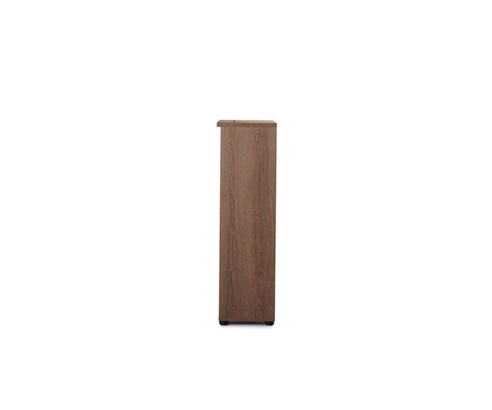 The Inari Low Bookcase, featuring a tall, rectangular silhouette and a natural wood grain finish, is shown from the side against a white background. Perfect for office storage, this standalone piece offers both style and functionality.