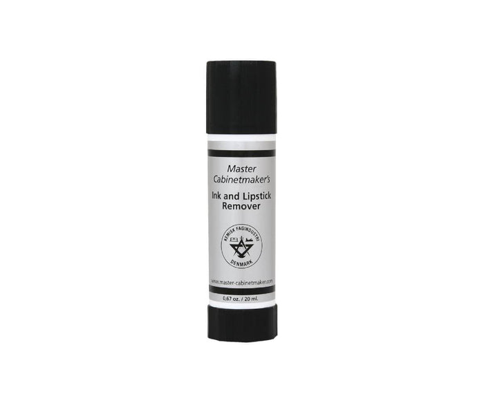 A compact cylindrical tube labeled Ink & Lipstick Remover, topped with a black cap and containing 20 ml, features a gentle water-based formula that makes it an effective solution for removing ink stains.