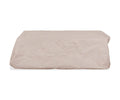 The Iona Coffee Table Cover in A02 Cream, a rectangular all-season outdoor furniture cover, rests on a white background. Its fabric displays gentle wrinkles, lending a soft, textured appearance and highlighting its water-resistant qualities for year-round protection.