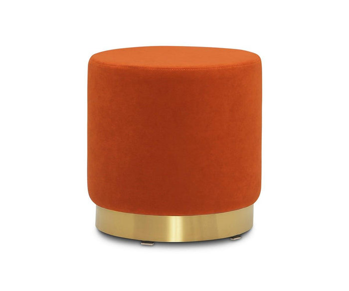 A round rust Isla Ottoman with smooth velvet upholstery and a shiny brass base, set against a white background.