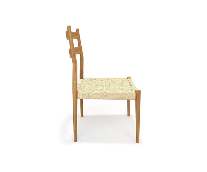 Side view of the Jake Dining Chair, featuring a wooden ladder back with a geometric design and a woven rope seat. The chair showcases a minimalist Scandinavian aesthetic, set against a plain white background.