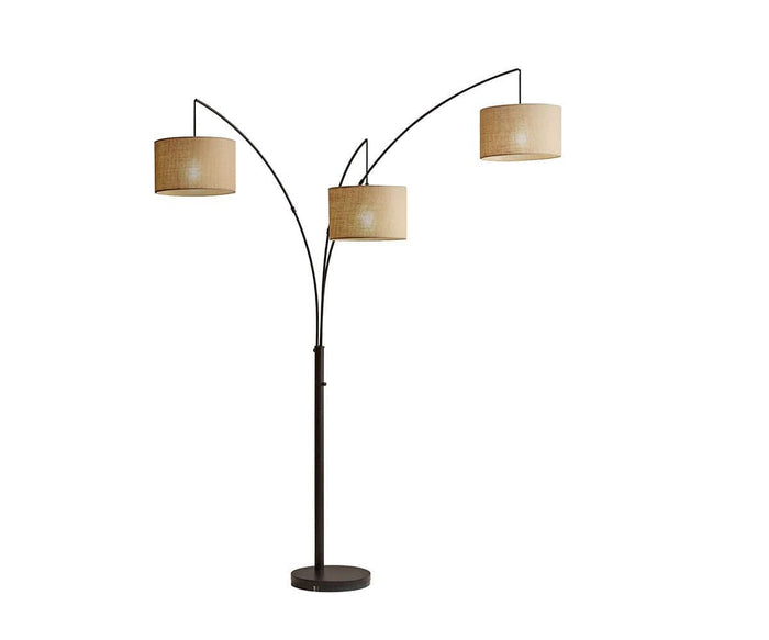 Jan 3-Light Arch Floor Lamp in dark bronze features three gracefully curved arms, each supporting a beige cylindrical lampshade crafted from textured fabric. The evenly spaced lampshades provide soft illumination, while the round, sturdy base ensures stability.