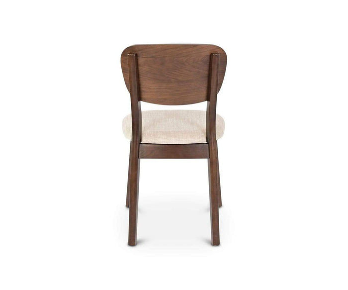 The Juneau Dining Chair, viewed from behind on a white background, showcases a mid-century design with an elegant walnut veneer, a curved backrest, and a light-colored cream fabric seat.