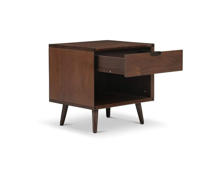 The Juneau Nightstand, featuring angled legs, an open lower shelf, and a partially open single drawer, is shown against a white background—an ideal piece of bedroom furniture for lovers of classic style.