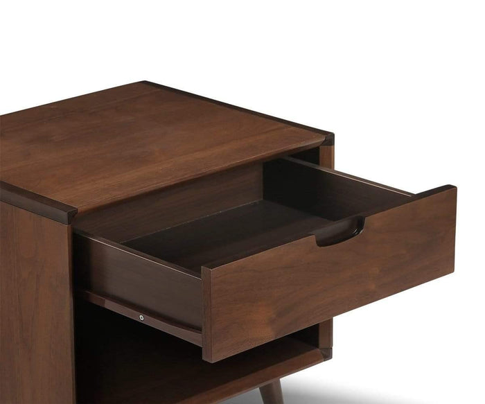 The Juneau Nightstand, a mid-century design crafted from wood, features an open drawer with a simple cutout handle and a shelf below. Shown against a white background, this timeless single-drawer piece adds understated style to any bedroom furniture collection.