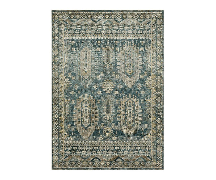 Karastan Marash Karamar Rug in Karamar Blue features a rectangular shape and showcases a detailed, vintage-inspired pattern in shades of blue, beige, and cream. This durable rug highlights geometric and floral motifs with a decorative border along all sides.