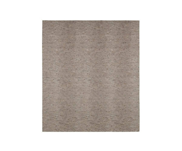 A rectangular, light brown area rug with a subtle, textured pattern is shown against a plain white background. For added comfort and protection, pair it with the Karastan Rug Pad in grey to keep your rug securely in place.