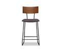 A modern Karsten Counter Stool with Back in Saddle Brown, featuring a live edge wood backrest, cushioned seat, and black metal legs, photographed against a plain white background.