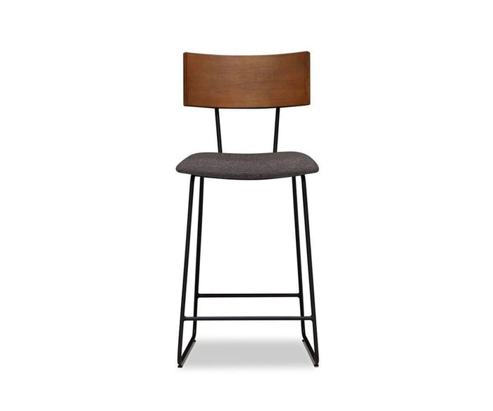 A modern Karsten Counter Stool with Back in Saddle Brown, featuring a live edge wood backrest, cushioned seat, and black metal legs, photographed against a plain white background.