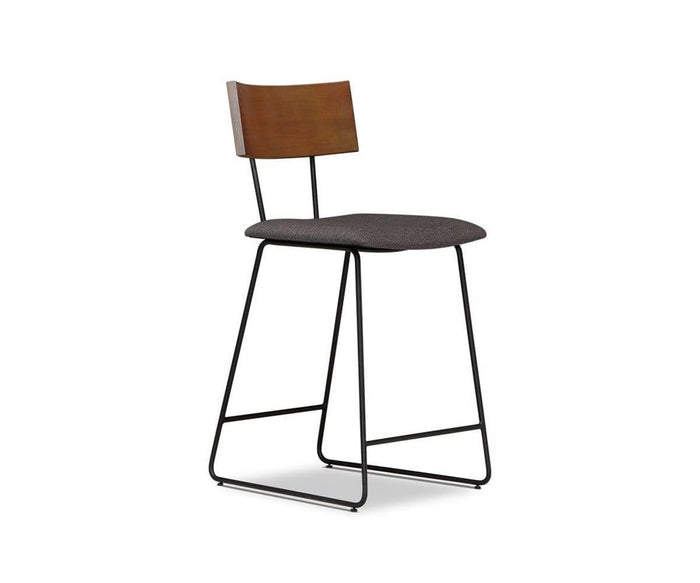 Introducing the Karsten Counter Stool with Back, this modern rustic industrial stool showcases a live edge wood backrest, a cushioned seat upholstered in dark fabric, and slim black metal legs—all beautifully photographed against a white background.