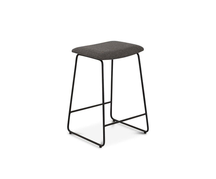 The Karsten Counter Stool showcases a modern rustic industrial design with a dark cushioned seat and minimalist black metal legs, displayed against a plain white background.