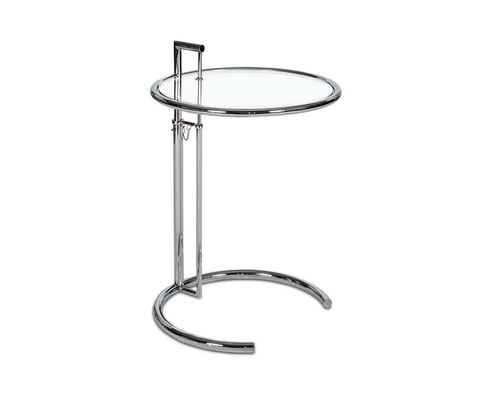 The Krom C-Table is a modern side table that features a clear glass top, a sleek chrome frame, an adjustable height, and a distinctive C-shaped base.