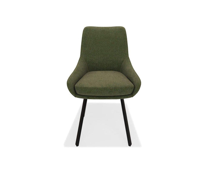 The Kyla Swivel Dining Chair in sage green features a cushioned seat and backrest with modern upholstery, angled black metal legs for sturdy support, and is shown from the front against a white background.