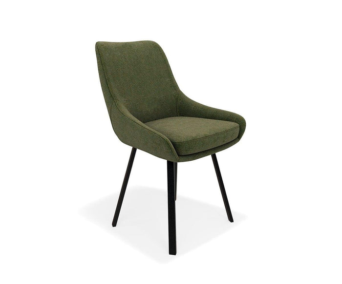 The Kyla Swivel Dining Chair, featuring a modern green upholstered design with a curved backrest and cushioned seat, is supported by four angled black metal legs and displayed against a plain white background.