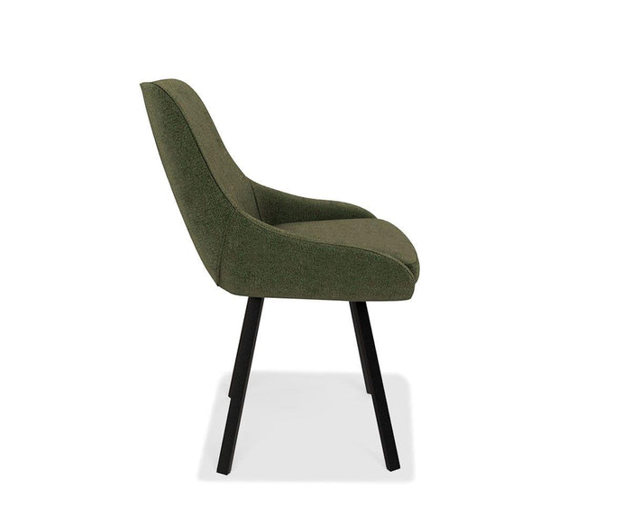 Side view of the Kyla Swivel Dining Chair in modern green upholstery, featuring a curved back and cushioned seat for comfort, with angled black legs and metal leg support, set against a white background.