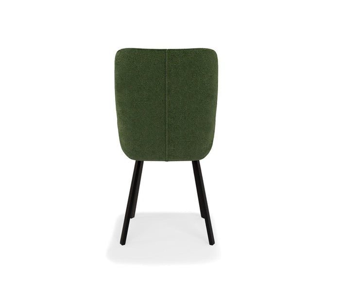 The Kyla Swivel Dining Chair is shown from the back against a white background, featuring green upholstery, a cushioned seat, and black legs with metal leg support.
