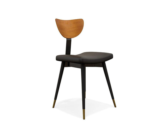 The Lanson Dining Chair is a modern mid-century dining chair with a curved bentwood backrest, a cushioned seat upholstered in black faux leather, and four black legs finished with brass-colored tips, displayed against a white background.