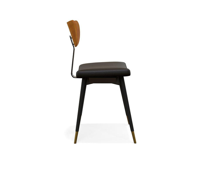 Side view of the Lanson Dining Chair, showcasing its modern mid-century design with a brown bentwood backrest, cushioned seat upholstered in black faux leather, black legs accented by gold-colored tips on the feet, all set against a white background.