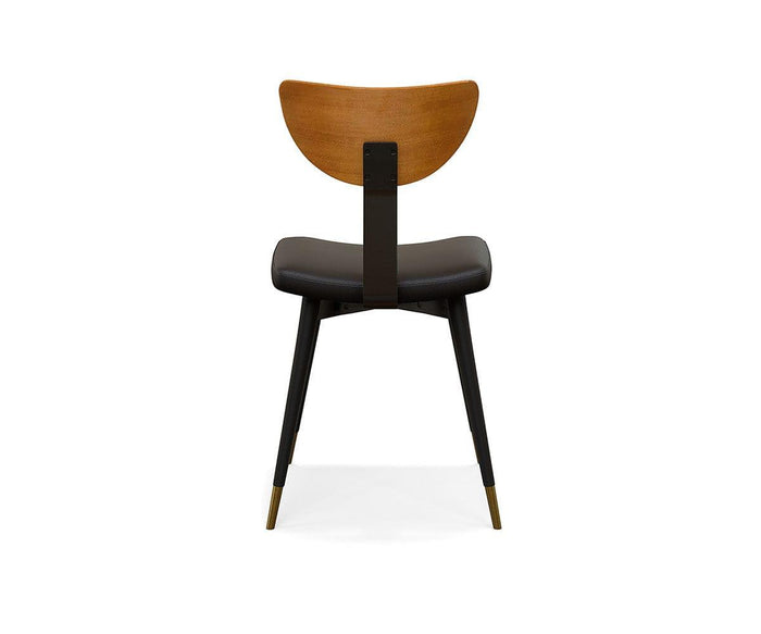 The Lanson Dining Chair is a modern mid-century piece, shown from the back against a white background, featuring a gracefully curved bentwood backrest, black faux leather seat cushion, and sleek black legs accented with brass-colored tips.