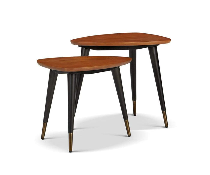 The Lanson Nest Of Tables showcases two mid-century modern nesting tables, expertly crafted from American poplar wood with triangular tops, black tapered legs, and brass-capped feet, set against a plain white background.