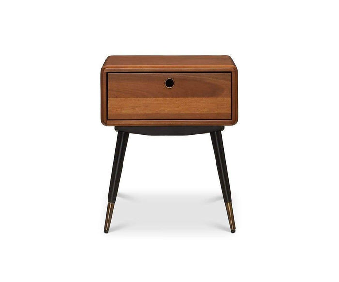Lanson Nightstand in a light walnut stain, showcasing a single drawer with a round pull hole, angled black legs, and refined brass-capped feet, displayed against a plain white background.