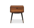 Lanson Nightstand in a light walnut stain, showcasing a single drawer with a round pull hole, angled black legs, and refined brass-capped feet, displayed against a plain white background.