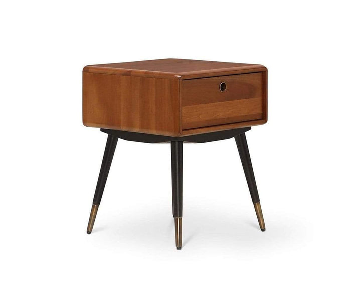 Introducing the Lanson Nightstand, a mid-century modern piece crafted from solid poplar, featuring a single drawer with a round handle. This nightstand stands on angled black legs accented with brass tips and is showcased against a crisp white background.