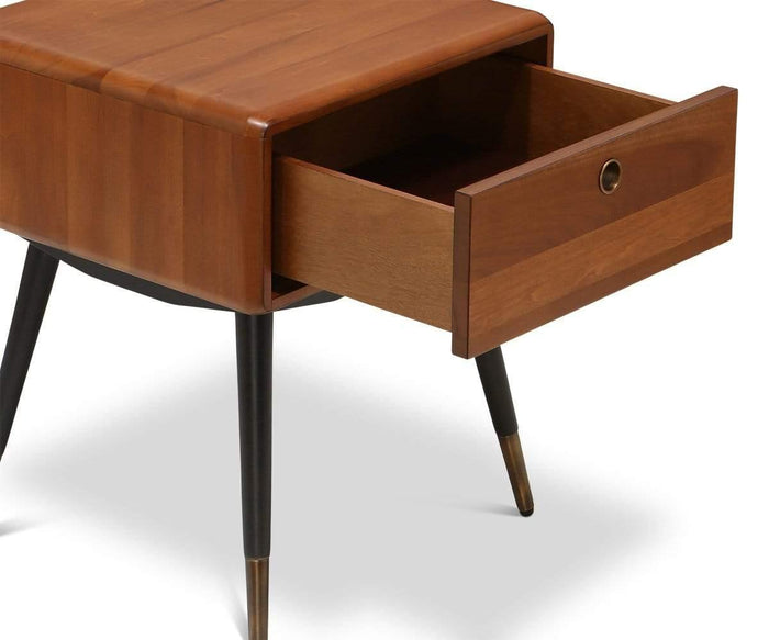 The Lanson Nightstand, crafted from wood with a smooth finish, features four tapered legs and a single partially open drawer that highlights its simple mid-century design.
