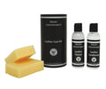 The Leather Care Kit includes two yellow sponges, a black cylindrical container, and bottles of leather cleaner and conditioner—all labeled Master Cabinetmakers—making it ideal for preserving the beauty and durability of your leather furniture.