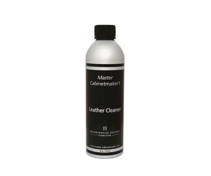 A silver bottle with a black label reads “Leather Cleaner” and “Scandinavian Designs Furniture.” Specially formulated for smooth leather, this bottle has a black cap and contains 16 oz (473 ml) of cleaner designed to care for your leather furniture.