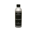 A silver and black bottle labeled Leather Conditioner with a black cap, standing upright on a white background—ideal for smooth leather and essential for complete leather furniture maintenance.